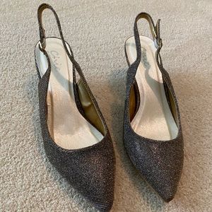 Glittery silver with a gold tint 1 inch heels.